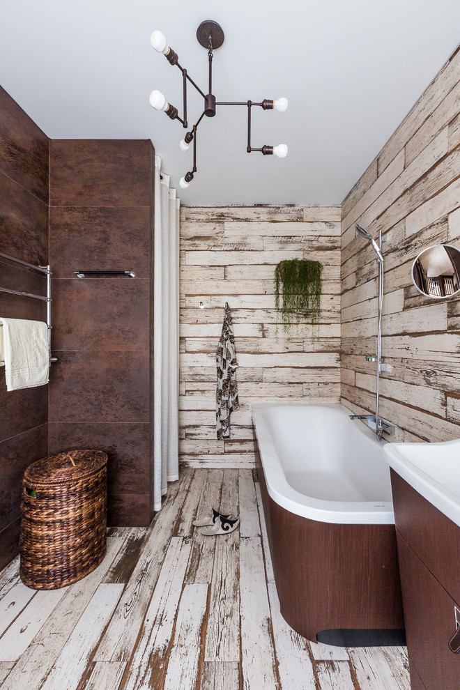 Country master bathroom in Other with flat-panel cabinets, brown tile, an integrated sink, dark wood cabinets, a drop-in tub, a shower/bathtub combo, multi-coloured walls, light hardwood floors, multi-coloured floor and an open shower.
