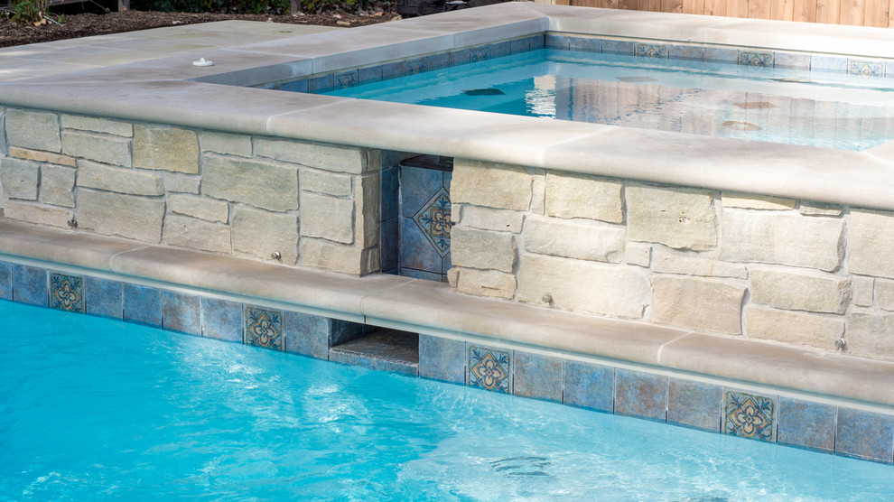 Pool - large rustic backyard concrete paver and rectangular lap pool idea in Chicago