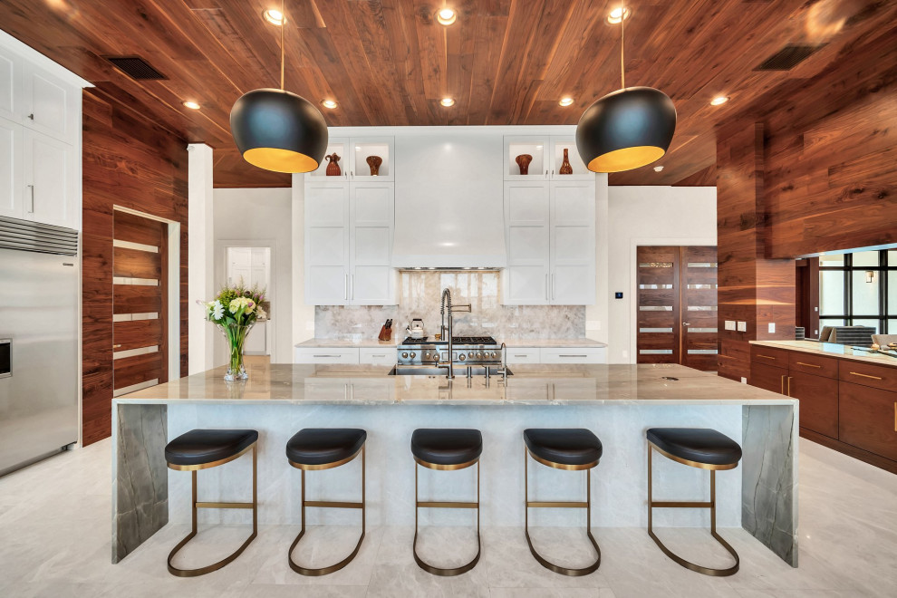 Eat-in kitchen - large transitional u-shaped wood ceiling eat-in kitchen idea in Orlando with a farmhouse sink, shaker cabinets, white cabinets, stainless steel appliances and an island