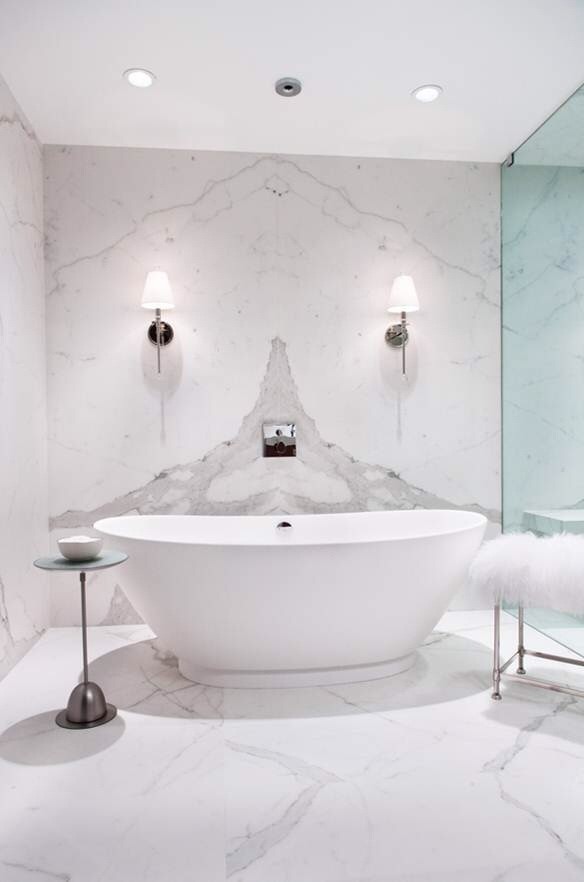 Design ideas for a transitional bathroom in New York with porcelain tile and white walls.