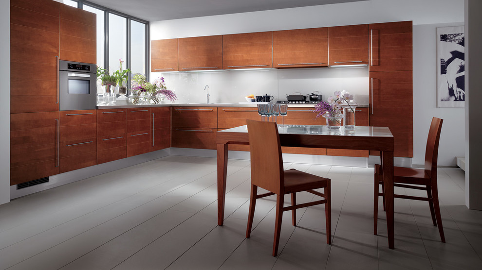 Inspiration for a large modern l-shaped eat-in kitchen in Melbourne with a single-bowl sink, raised-panel cabinets, brown cabinets, stainless steel benchtops, stainless steel appliances, painted wood floors and multiple islands.