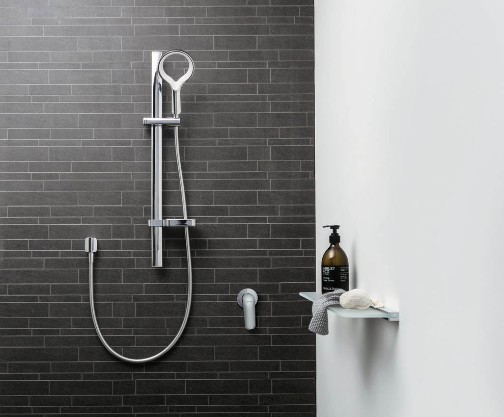 This is an example of a contemporary master home design in Melbourne with an open shower and gray tile.