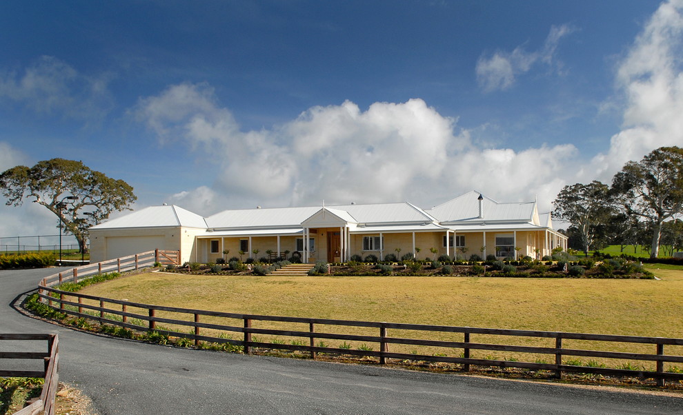 Inspiration for an expansive country one-storey exterior in Adelaide with stone veneer.