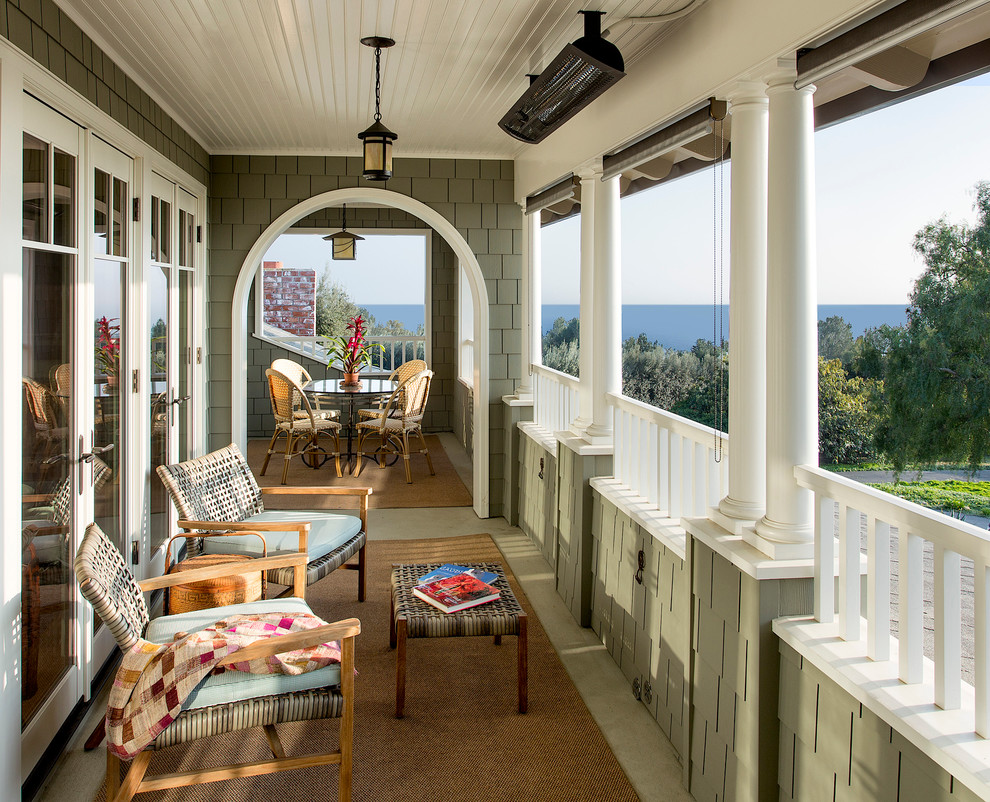 This is an example of a mid-sized traditional verandah in Santa Barbara with a roof extension.