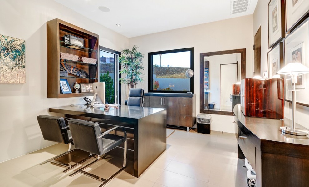 Design ideas for an expansive modern home office in Orange County with a freestanding desk.