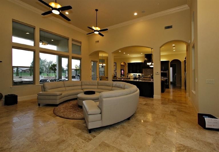Photo of an expansive mediterranean formal open concept living room in Other with beige walls.