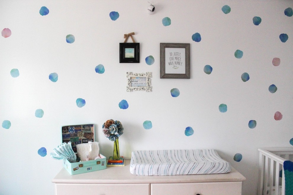 Design ideas for a mid-sized traditional gender-neutral nursery in Vancouver with white walls.