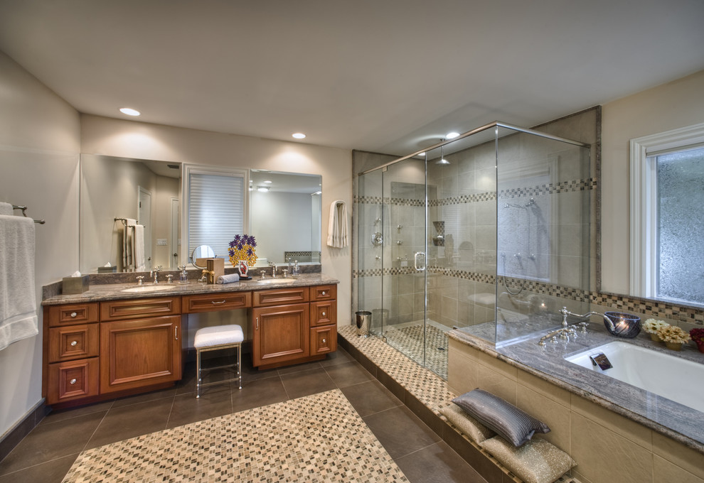 This is an example of a large traditional master bathroom in Los Angeles with an undermount sink, recessed-panel cabinets, granite benchtops, a double shower, multi-coloured tile, mosaic tile, grey walls, mosaic tile floors, medium wood cabinets and an undermount tub.