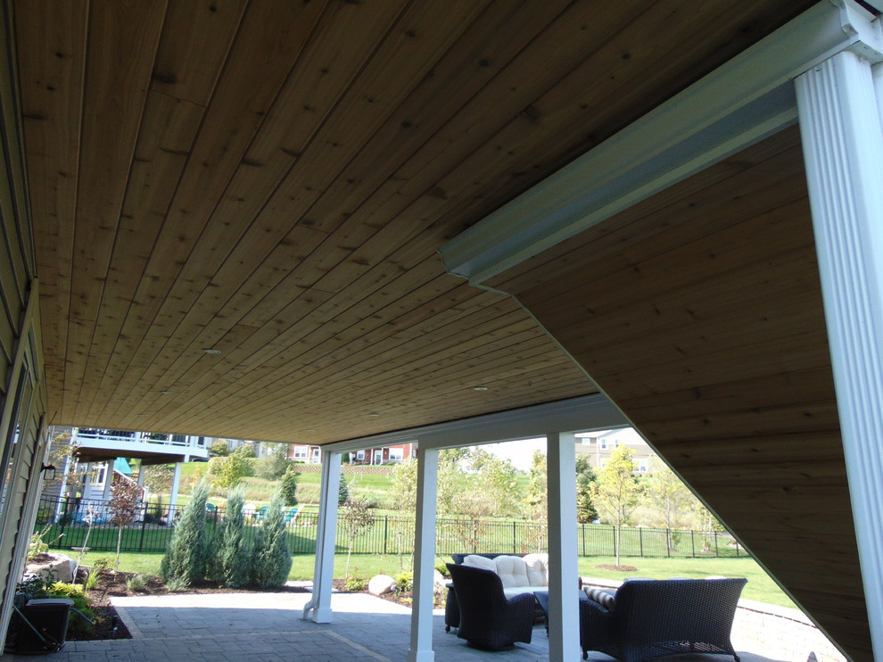Example of a large trendy backyard deck design with no cover