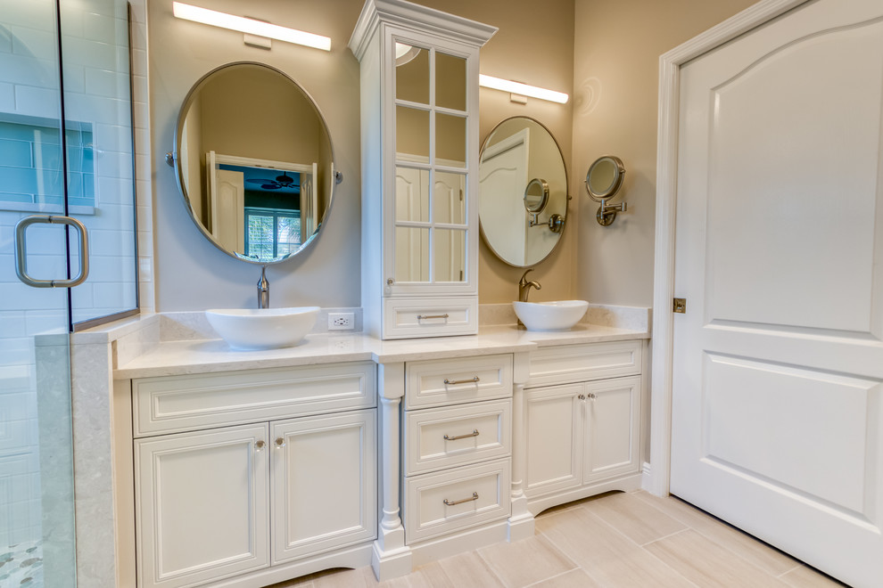 This is an example of a mid-sized transitional master bathroom in Miami with flat-panel cabinets, white cabinets, white tile, engineered quartz benchtops and white benchtops.