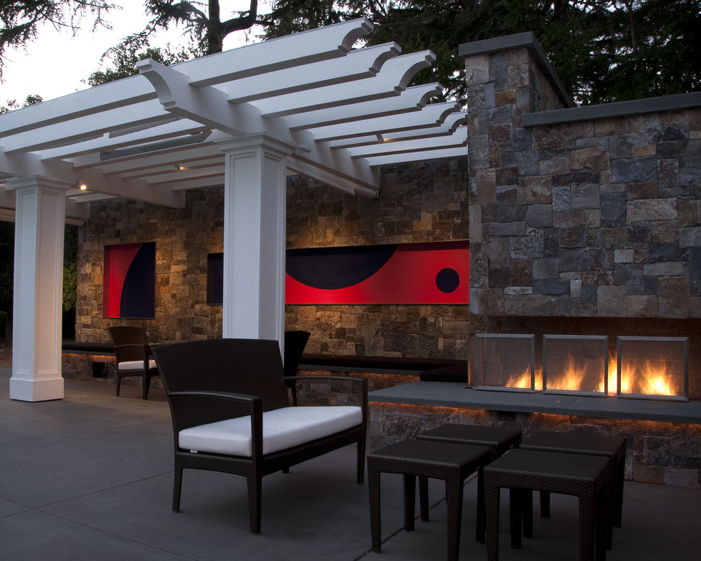 Traditional backyard patio in San Francisco with a fire feature and a pergola.