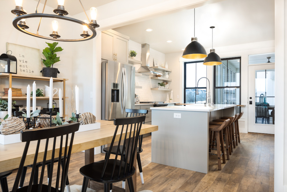 Inspiration for a large country galley eat-in kitchen in Other with a farmhouse sink, shaker cabinets, grey cabinets, quartz benchtops, yellow splashback, brick splashback, stainless steel appliances, vinyl floors, with island, brown floor and white benchtop.