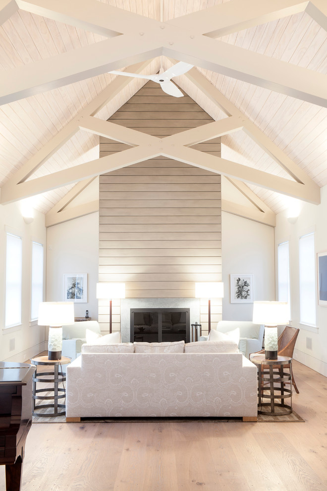 Inspiration for a transitional formal living room in Boston with white walls and light hardwood floors.