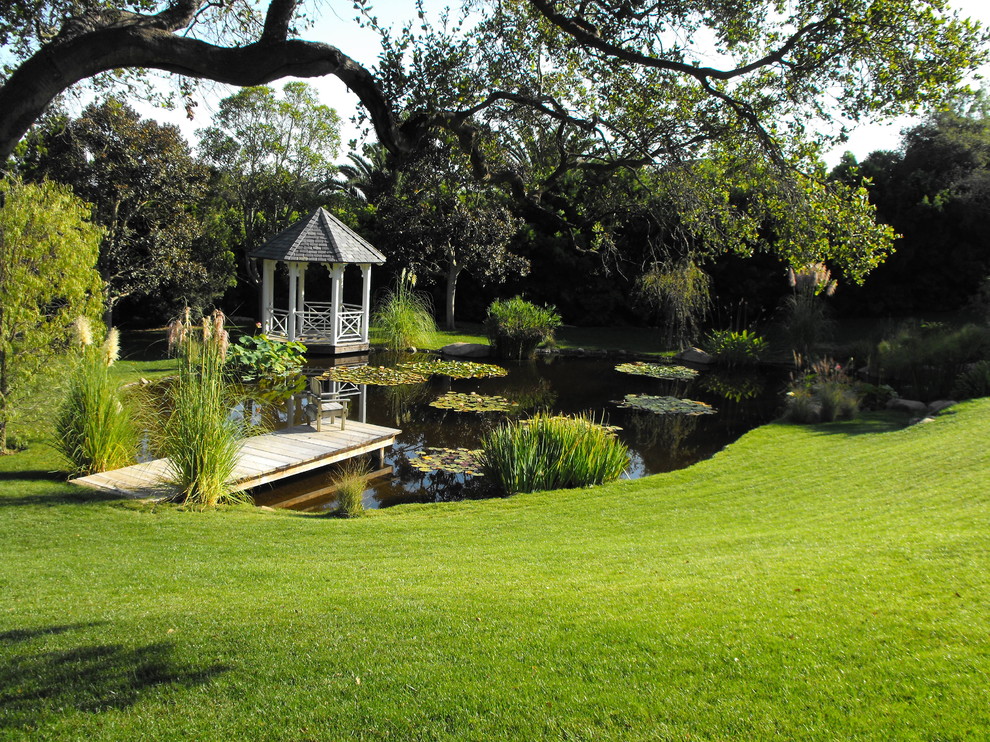 Design ideas for a traditional backyard garden in Santa Barbara with with pond.