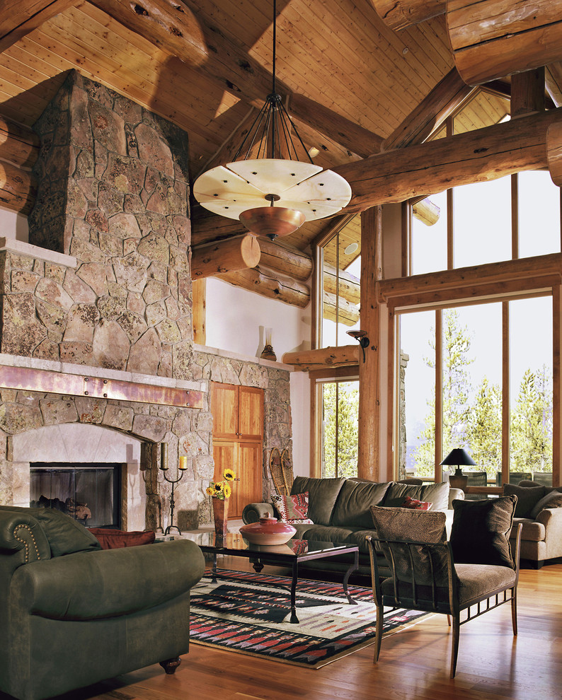 Design ideas for a traditional living room in Denver with a stone fireplace surround.