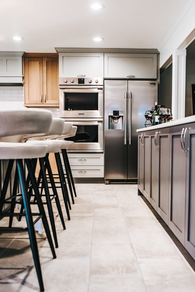 Example of a transitional kitchen design in Seattle