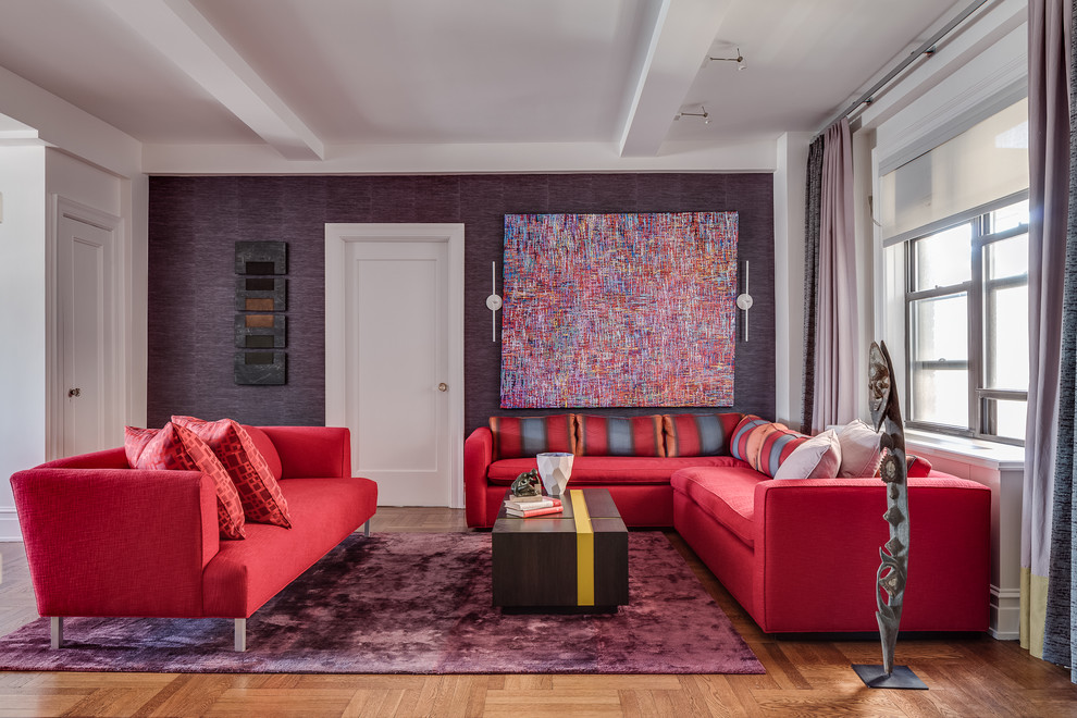 Example of a mid-sized trendy open concept light wood floor living room design in New York with purple walls