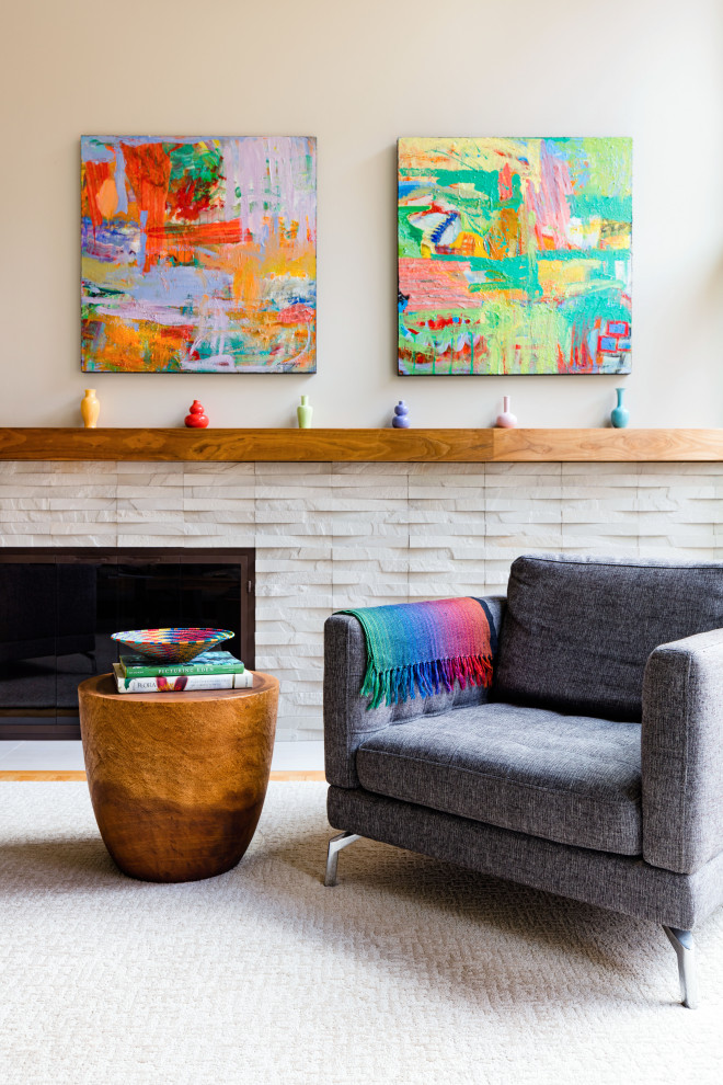 Inspiration for a mid-sized midcentury open concept living room in Seattle with multi-coloured walls, light hardwood floors, a standard fireplace, a stone fireplace surround and no tv.