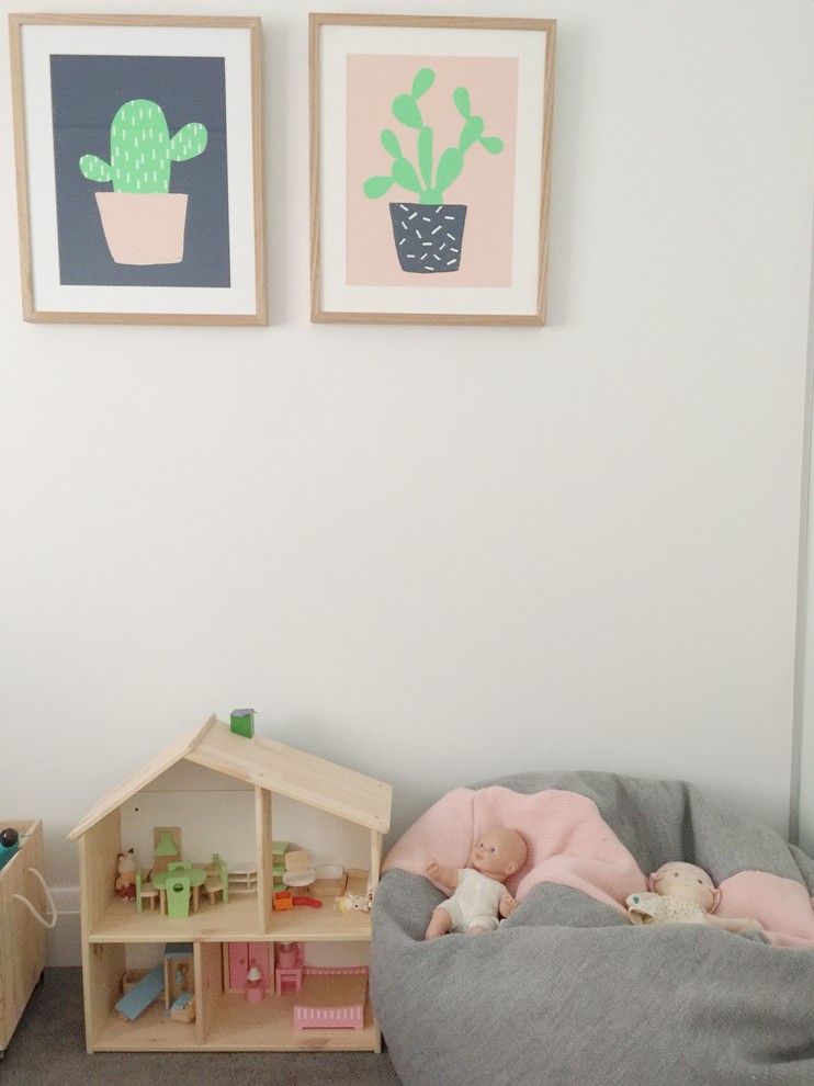 This is an example of a mid-sized scandinavian kids' bedroom for kids 4-10 years old and girls in Sydney with pink walls and carpet.