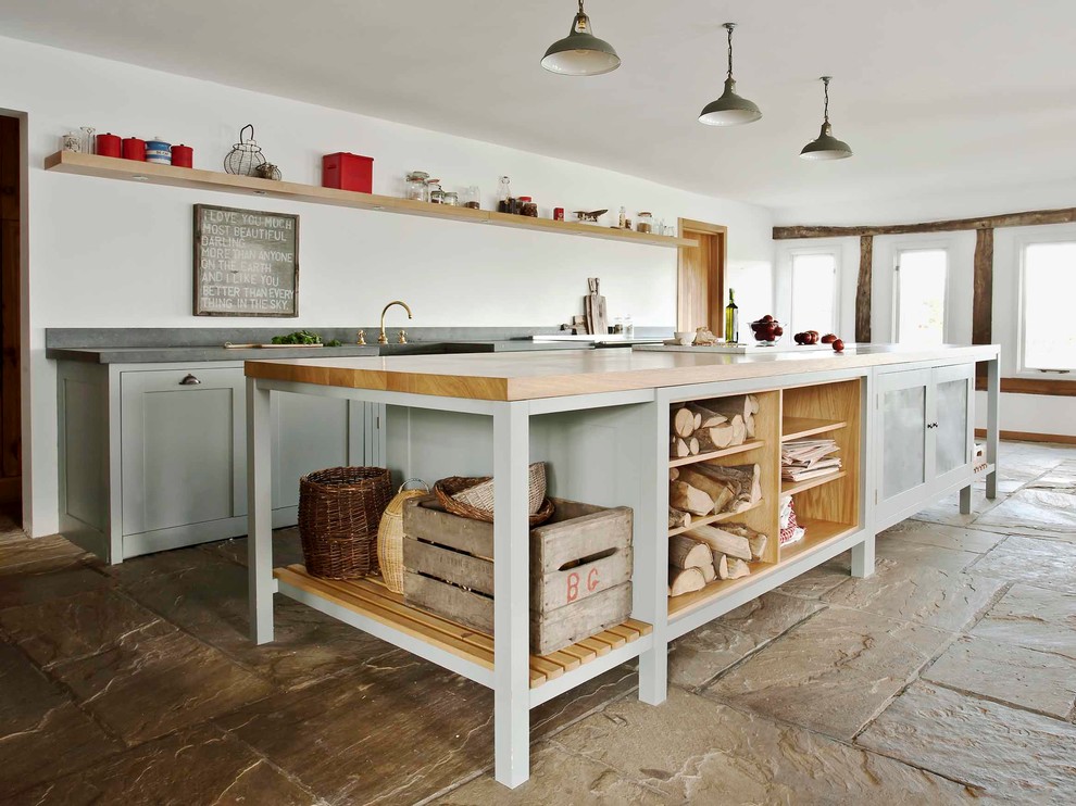 Photo of a country kitchen in London with open cabinets and with island.