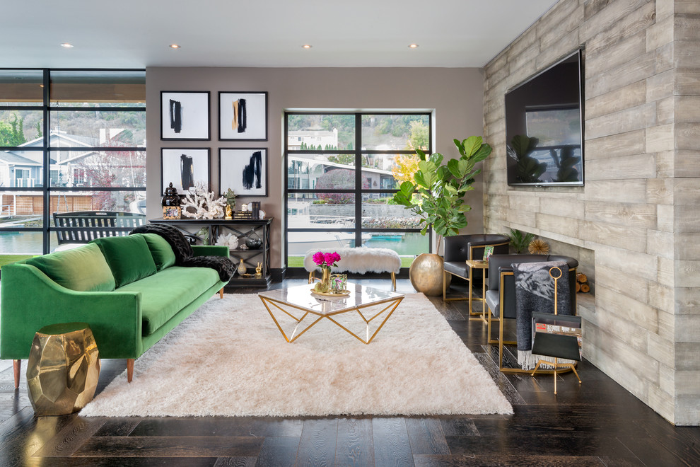 This is an example of a mid-sized contemporary formal open concept living room in San Francisco with beige walls, dark hardwood floors, no fireplace and a wall-mounted tv.