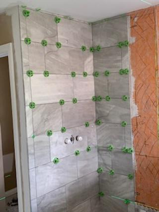 How to handle uneven ceiling and tile in a shower