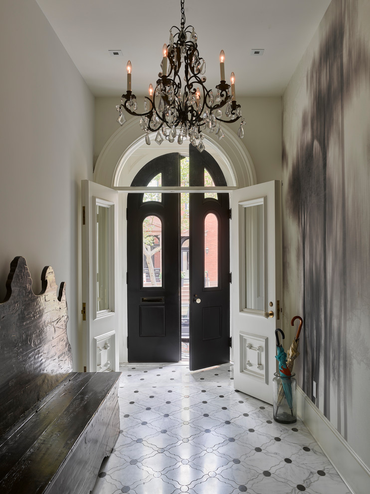 Example of a large transitional porcelain tile and multicolored floor entryway design in New York with white walls and a dark wood front door