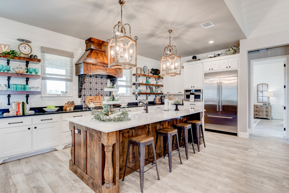 Mid-sized country single-wall eat-in kitchen photo in Dallas with an island