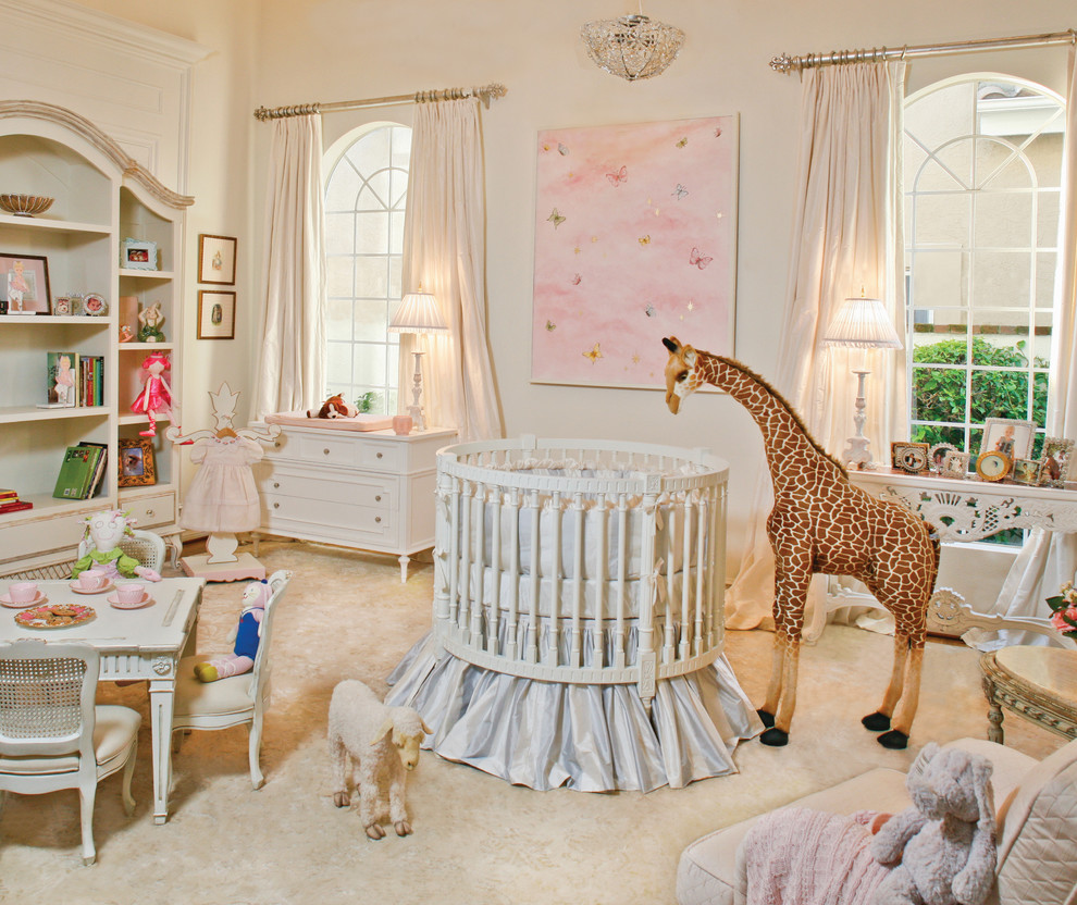 Design ideas for an expansive traditional nursery for girls in Los Angeles with white walls and carpet.
