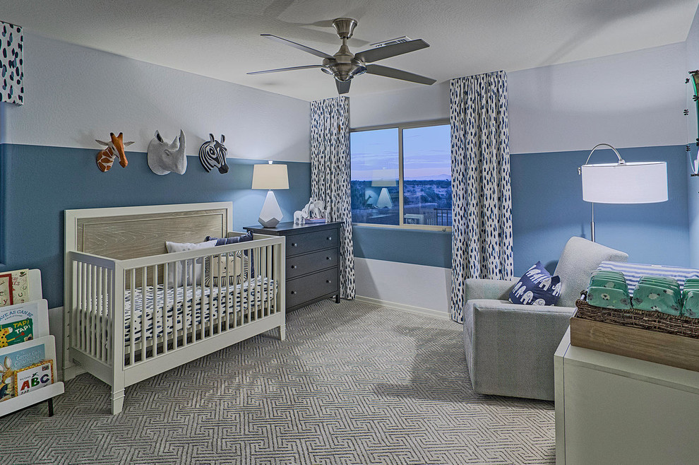 Inspiration for a mid-sized traditional nursery for boys in Milwaukee with blue walls and carpet.