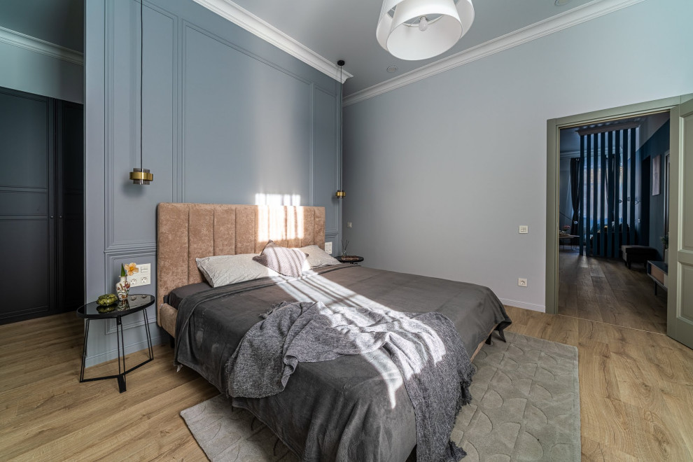Mid-sized scandinavian master bedroom in Saint Petersburg with grey walls, medium hardwood floors, no fireplace, brown floor and wallpaper.
