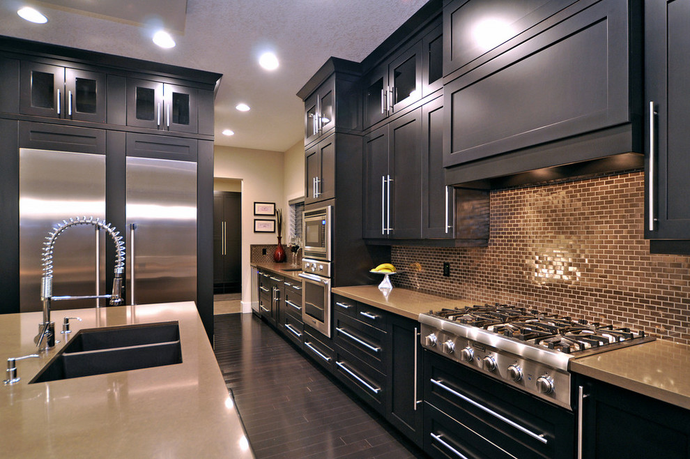 Design ideas for a contemporary kitchen in Calgary with stainless steel appliances, a double-bowl sink, black cabinets, metallic splashback and metal splashback.