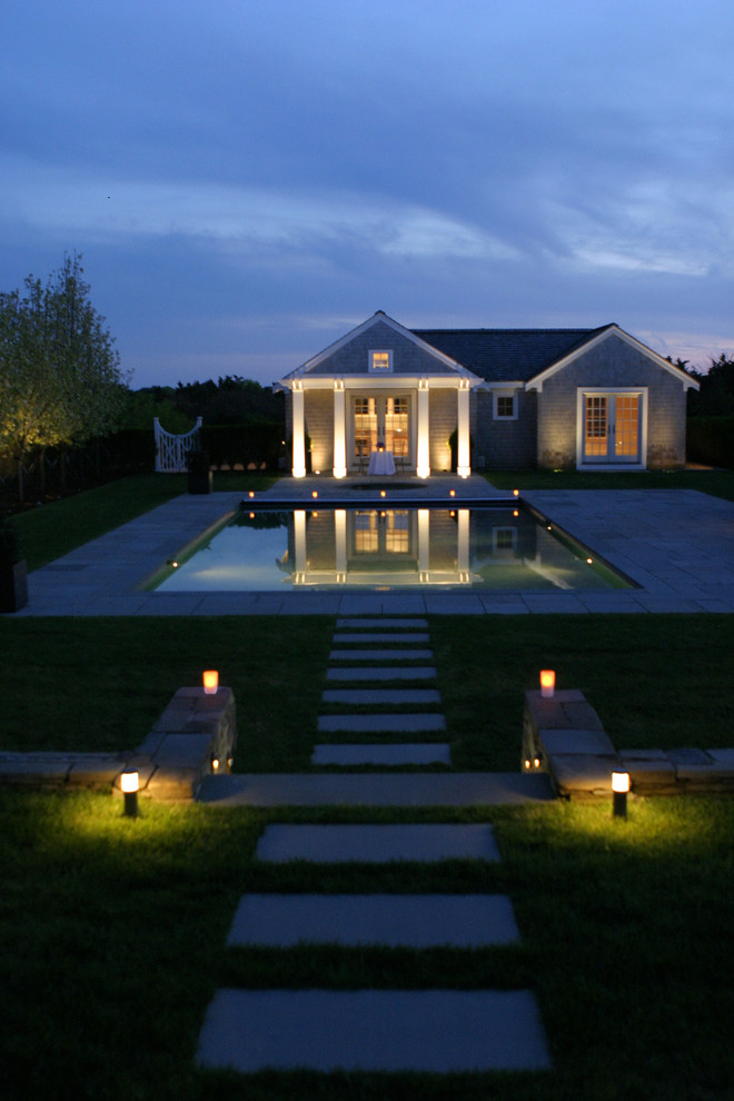 Inspiration for a traditional backyard pool in Boston with a pool house.
