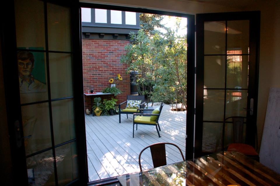 This is an example of a large traditional backyard deck in Other.