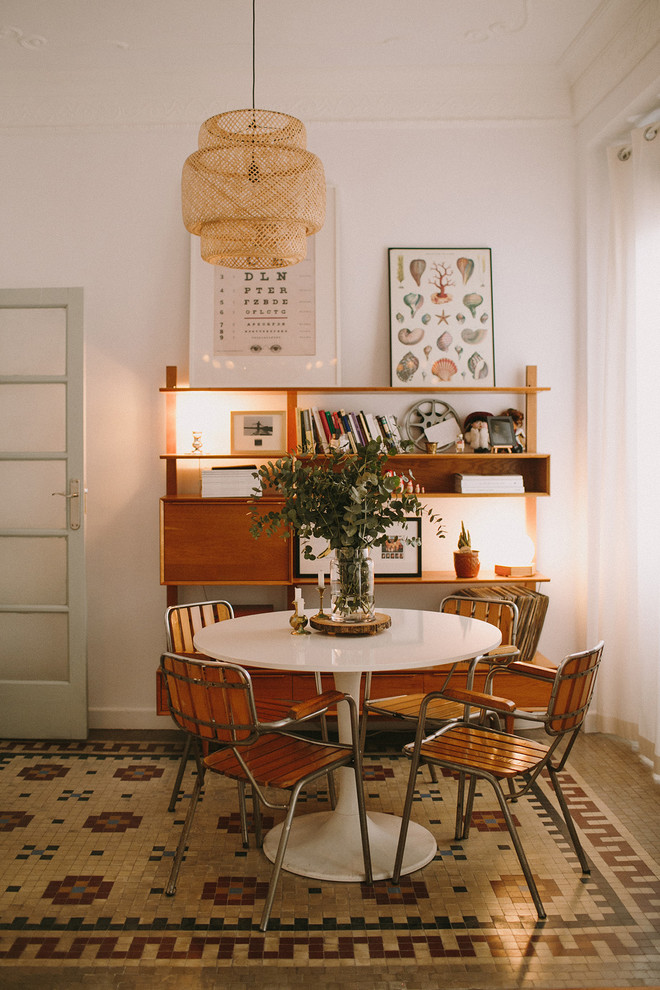 Photo of a midcentury dining room in Valencia with white walls and no fireplace.