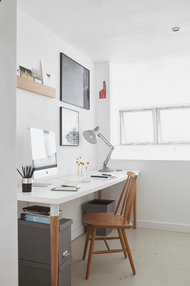 Scandinavian home office in London with white walls, no fireplace and a freestanding desk.