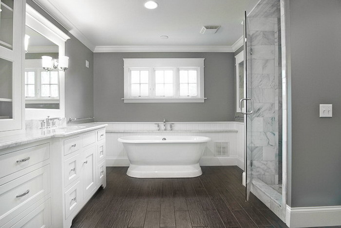 Inspiration for a large contemporary master bathroom in Atlanta with an undermount sink, white cabinets, granite benchtops, a corner shower, glass tile, grey walls, bamboo floors, recessed-panel cabinets and a freestanding tub.