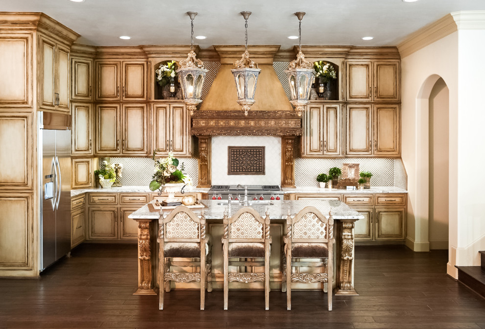 Inspiration for a mid-sized traditional u-shaped eat-in kitchen in Dallas with an undermount sink, distressed cabinets, white splashback, stainless steel appliances, dark hardwood floors, with island, brown floor, white benchtop, raised-panel cabinets, granite benchtops and glass sheet splashback.