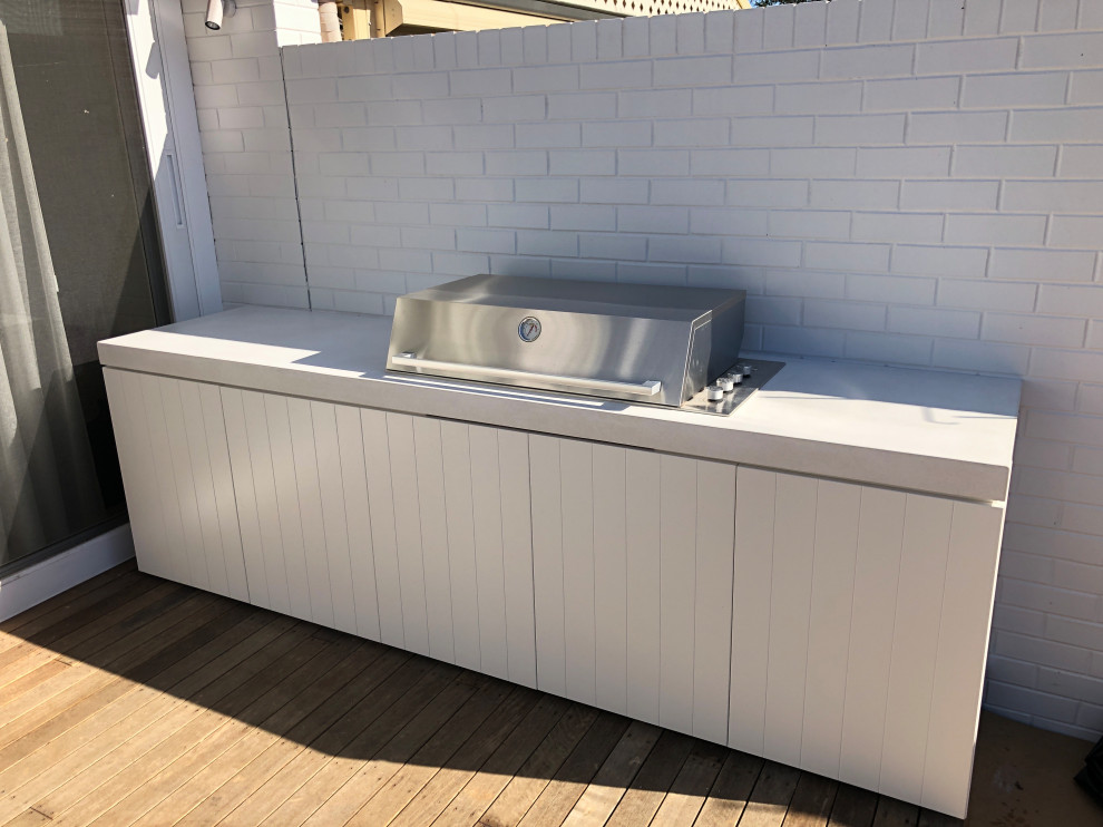 Outdoor Kitchen with a polished concrete benchtop & stainless steel