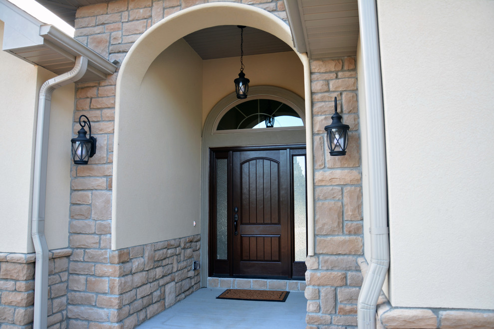 Example of a mid-sized transitional two-story mixed siding multicolored entryway design