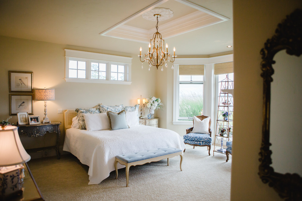 Design ideas for a mid-sized country master bedroom in Seattle with beige walls, carpet, a standard fireplace and a stone fireplace surround.