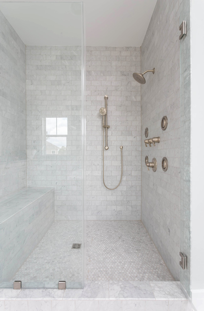 Design ideas for a large transitional master bathroom in Charleston with shaker cabinets, white cabinets, a freestanding tub, gray tile, marble, grey walls, porcelain floors, an undermount sink, quartzite benchtops, grey floor, a hinged shower door and grey benchtops.