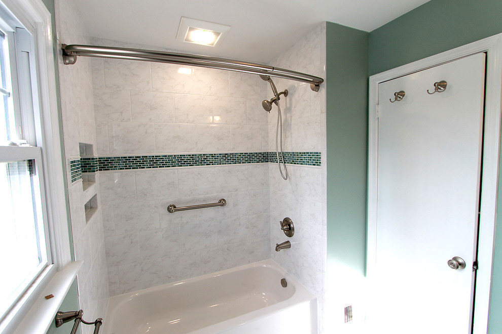 Photo of a traditional bathroom in DC Metro with an alcove tub, a two-piece toilet, yellow tile, ceramic tile, green walls and ceramic floors.