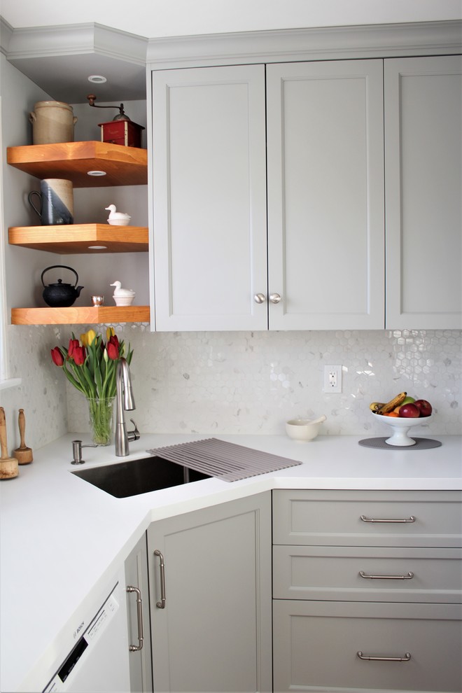 Inspiration for a small transitional u-shaped eat-in kitchen in Toronto with an undermount sink, shaker cabinets, grey cabinets, quartz benchtops, white splashback, white appliances, terrazzo floors, red floor, white benchtop, no island and mosaic tile splashback.