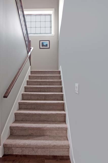 Example of an arts and crafts staircase design in Vancouver