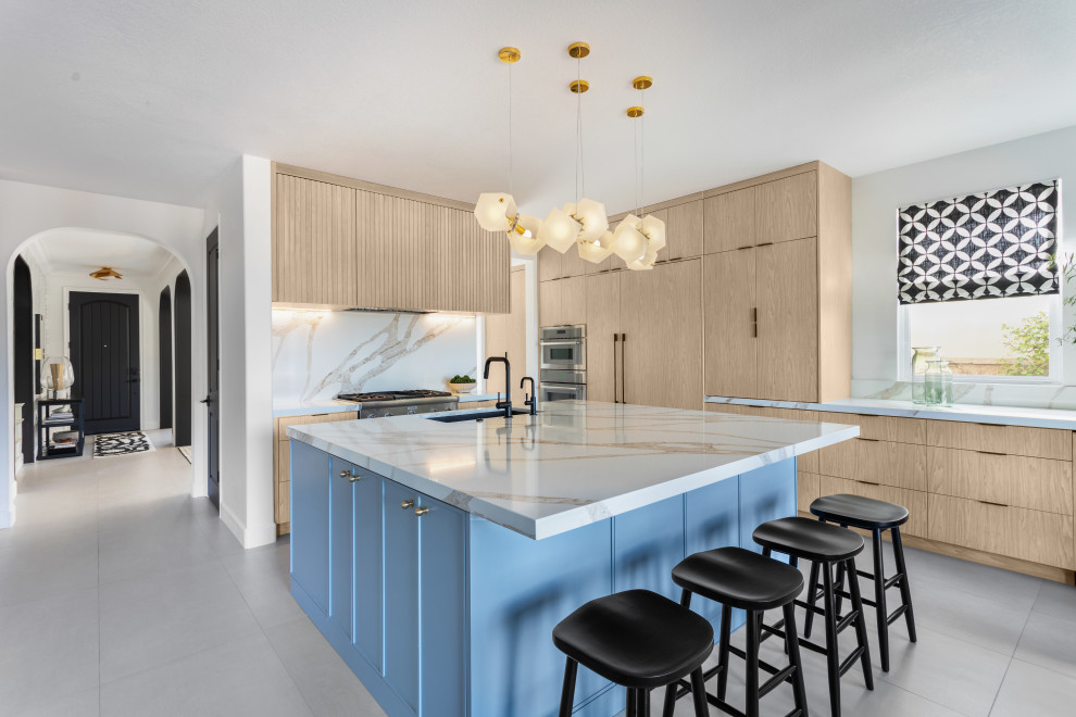 Kitchen - large contemporary l-shaped porcelain tile and gray floor kitchen idea in Los Angeles with a single-bowl sink, flat-panel cabinets, light wood cabinets, quartz countertops, quartz backsplash, paneled appliances, an island and multicolored countertops