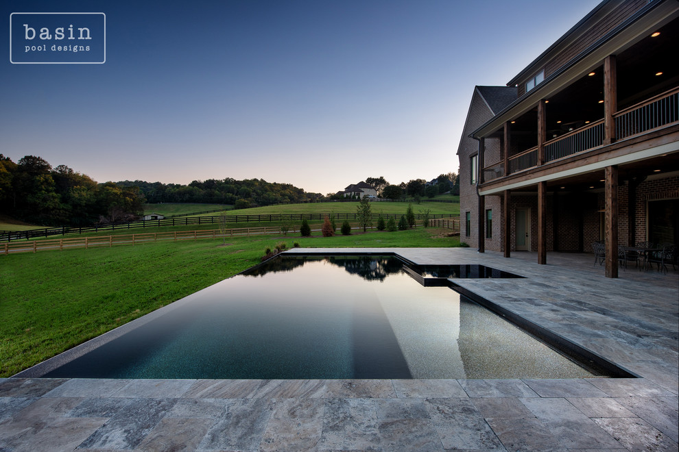 Hot tub - large transitional backyard stone and custom-shaped infinity hot tub idea in Nashville