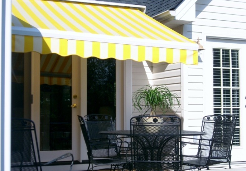 Inspiration for a traditional backyard patio in Other with decking and an awning.