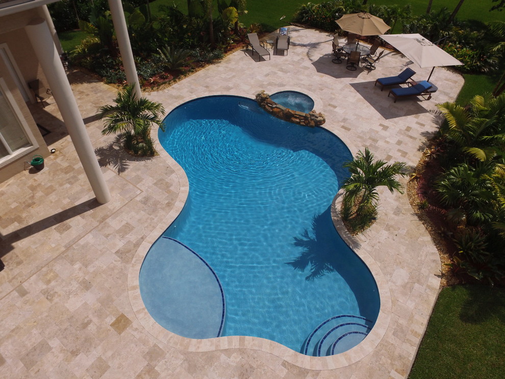 Free Form Swimming Pool with natural rock spillover - Contemporary ...