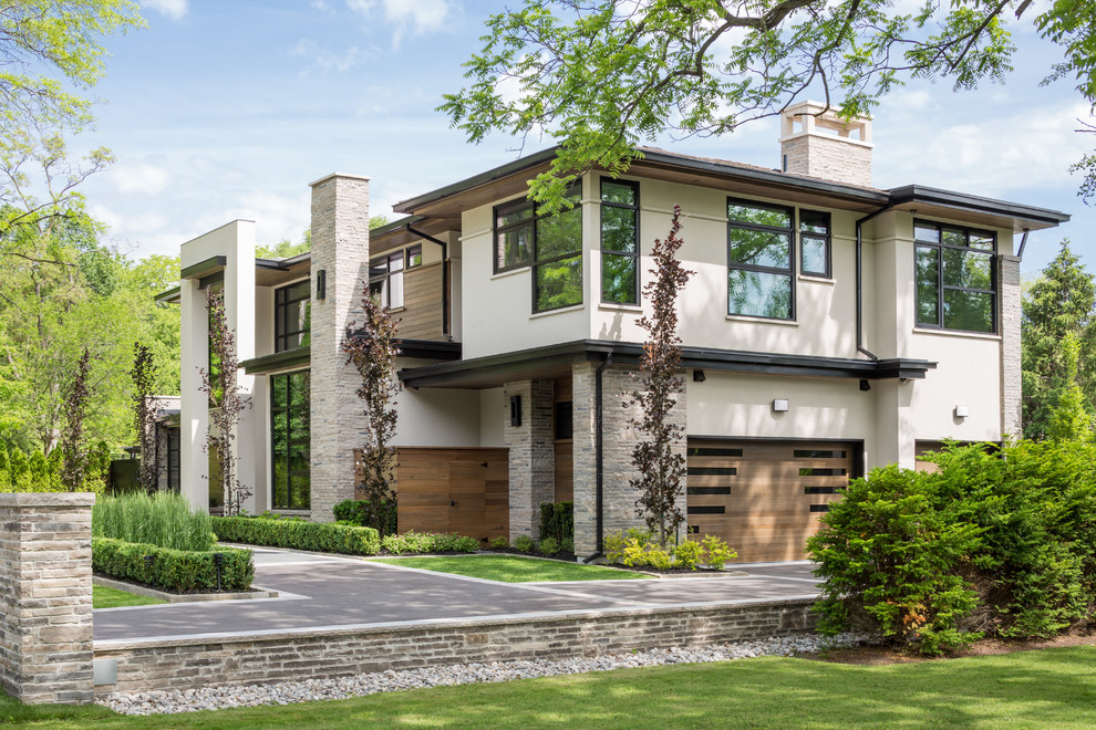 Inspiration for a large contemporary two-storey brown exterior in Toronto with wood siding.
